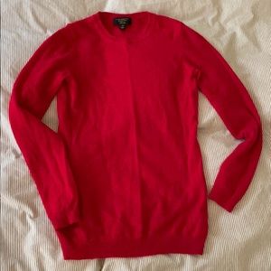 Gently worn red cashmere sweater .